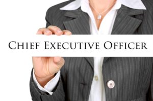 Woman holding the paper with the Chief Executive Officer label