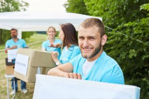 Volunteers as volunteers collect donations for charitable organizations