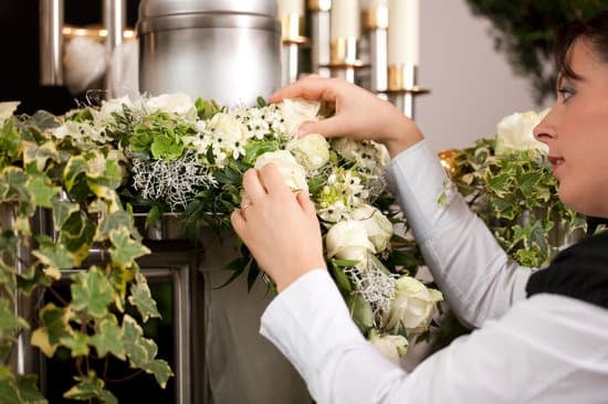 Woman fixing the flowers on a wreath
