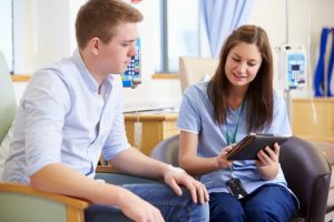 young man in campus clinic