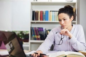 Young woman studying at home