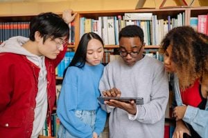 Students looking at a tablet