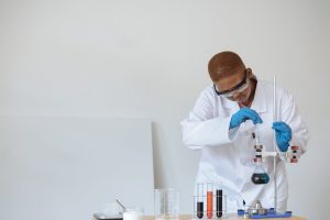 A science college student doing an experiment