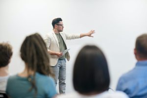A professor teaching in front of the class