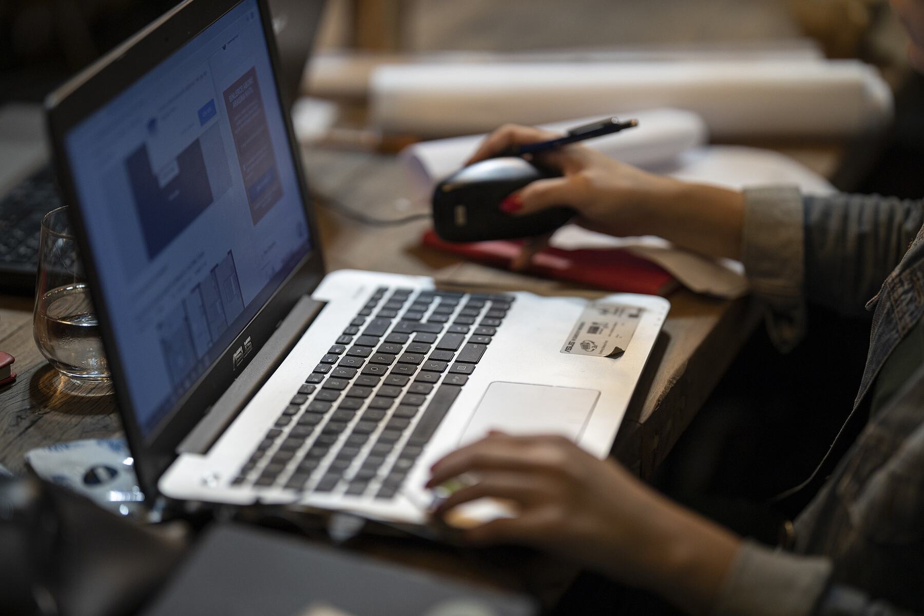 Woman reading a report on her laptop