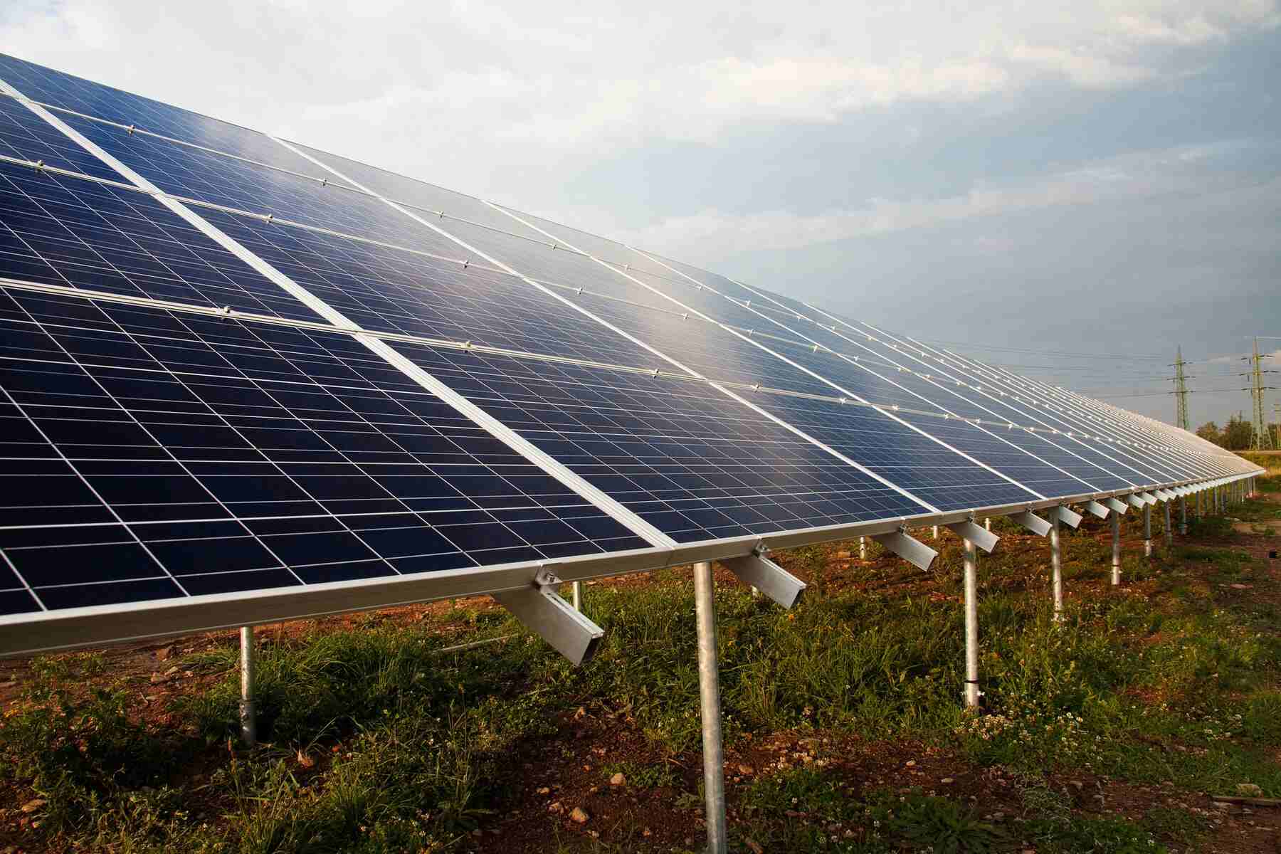 Solar panels installed on a field outdoors