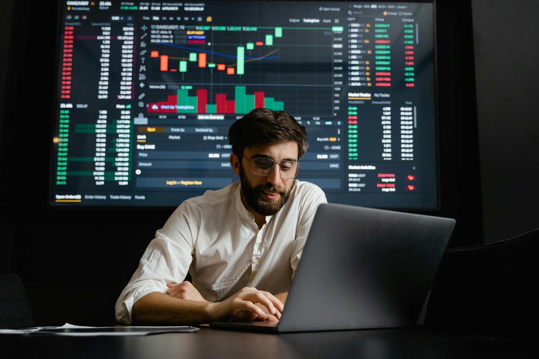 A market research analyst looking at his laptop