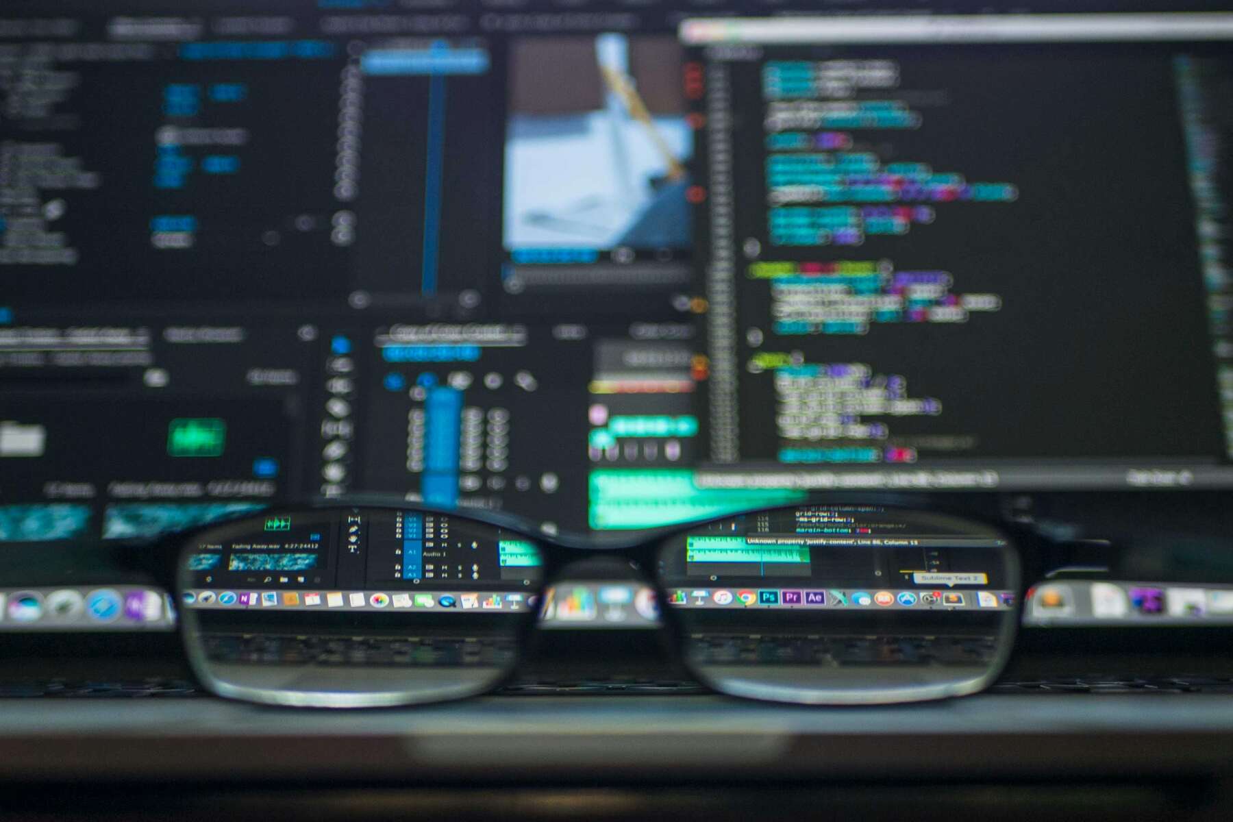 Eyeglasses placed on a laptop keypad