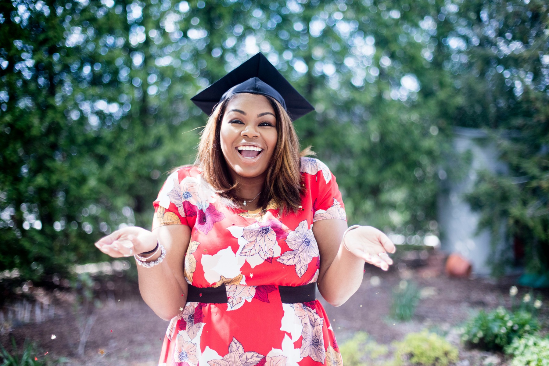 Woman wearing a dress and a graduation cap