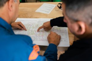 Two people looking at a diagram