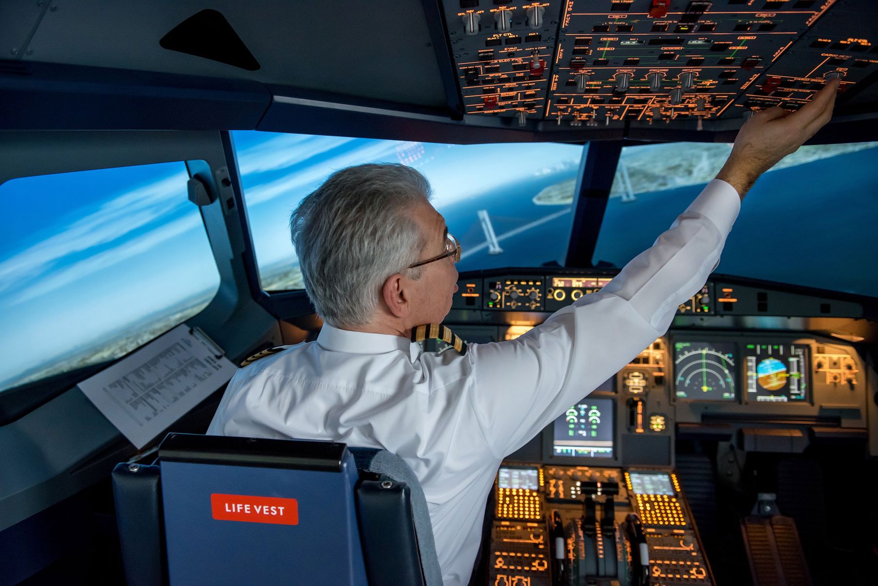 Pilot checking controls before landing