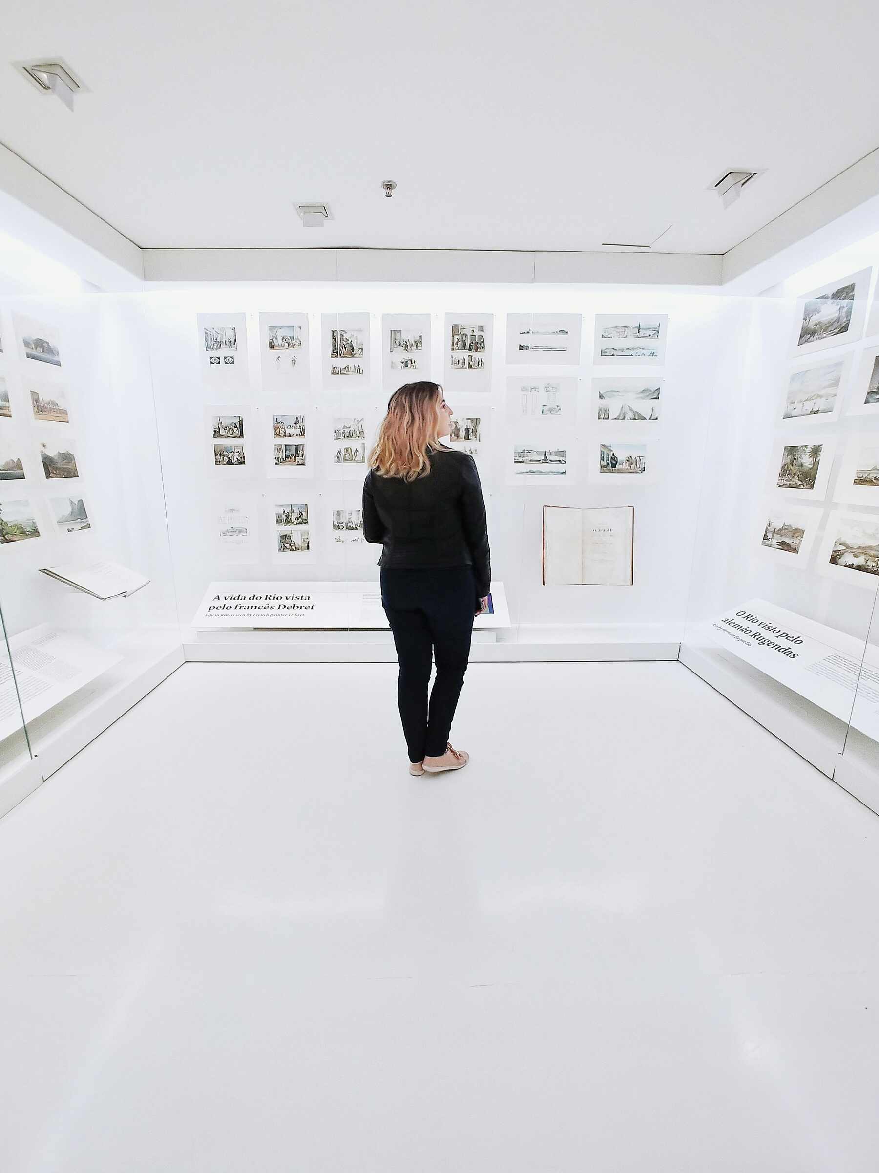A woman on a room with historic images