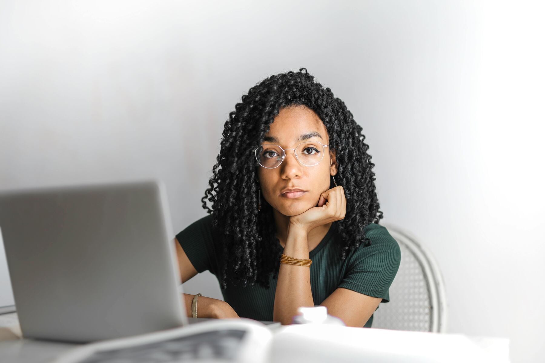 A female student with her laptop open in front of her